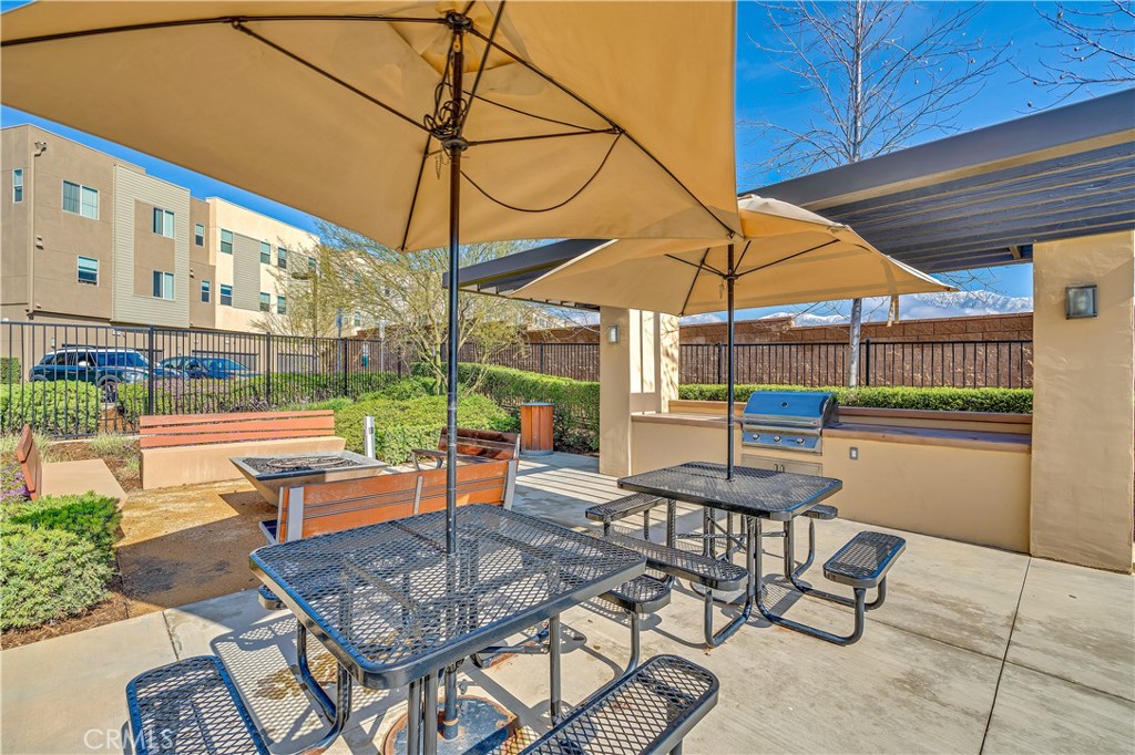 755 Sawyer Place Upland, CA 91786 - Photo 52 of 57 a view of a patio with a table and chairs under an umbrella