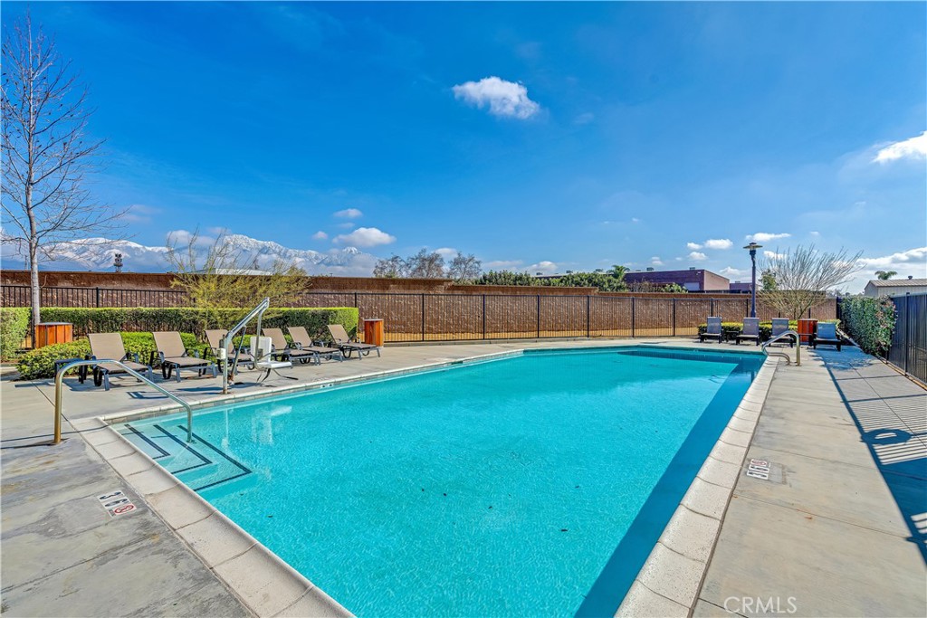 755 Sawyer Place Upland, CA 91786 - Photo 54 of 57 a view of a swimming pool with a lounge chairs