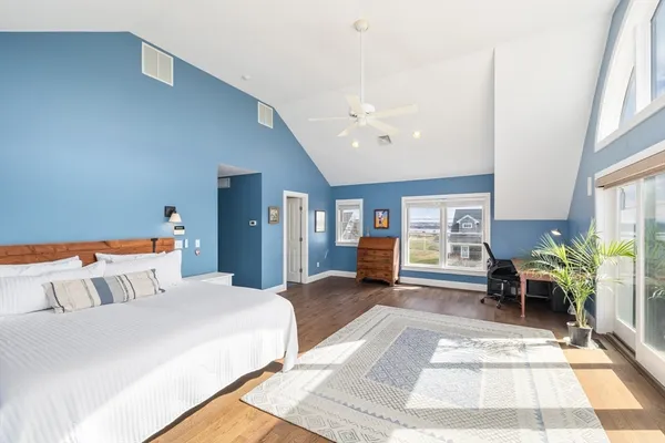 a bedroom with furniture and a rug