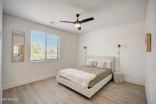 a bedroom with a bed and window