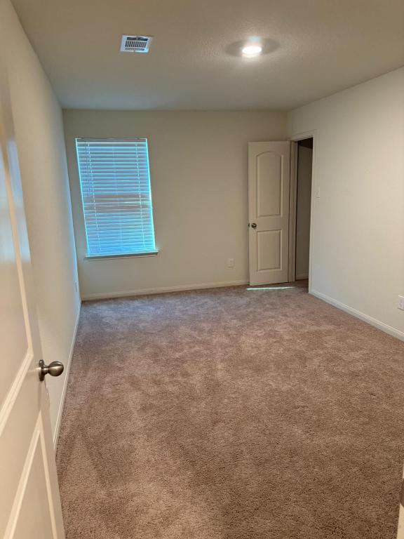14325 Boomtown Way Elgin, TX 78621 - Photo 12 of 29 an empty room with windows