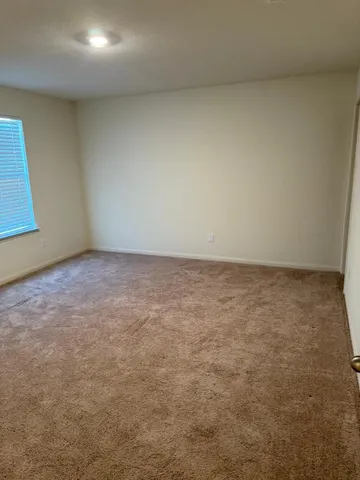 a bathroom with a toilet and a bathtub