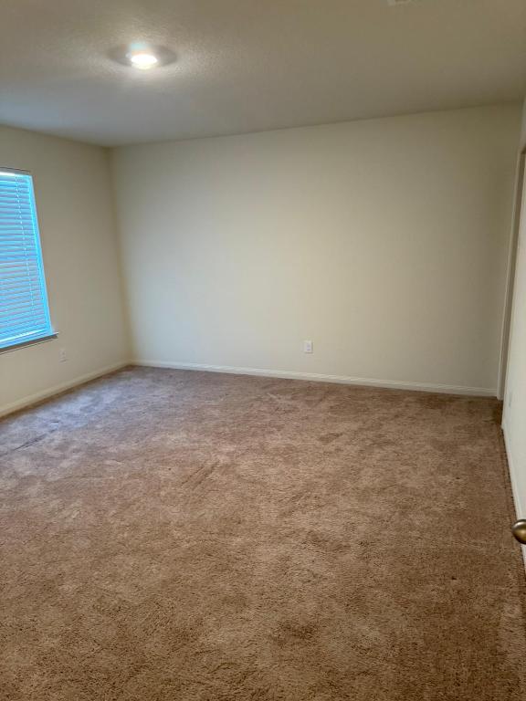 14325 Boomtown Way Elgin, TX 78621 - Photo 13 of 29 an empty room with a natural light