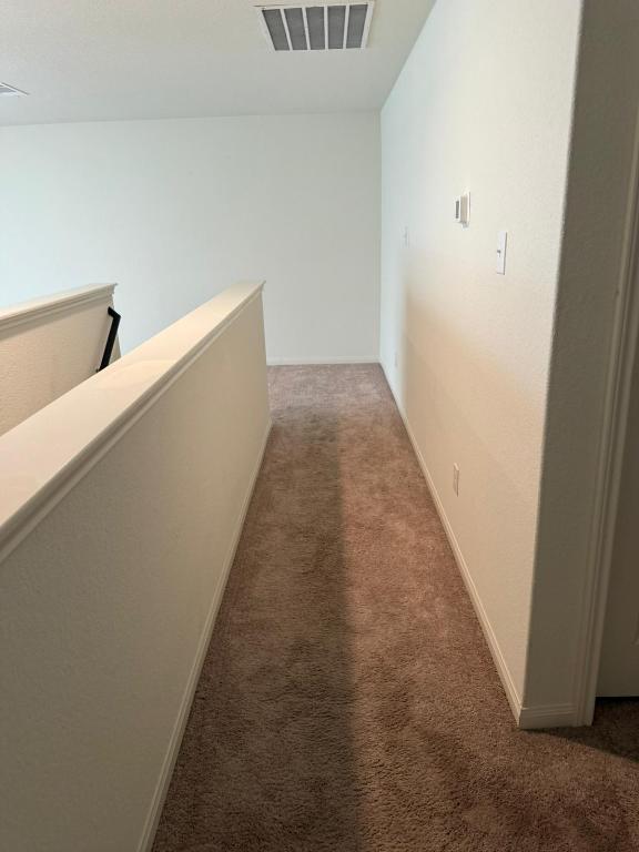 14325 Boomtown Way Elgin, TX 78621 - Photo 8 of 29 a view of a hallway with stairs