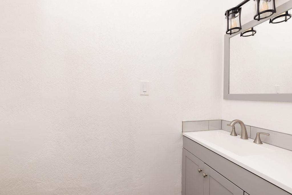 28369 Road 400 Madera, CA 93636 - Photo 11 of 33 a bathroom with a sink and a mirror