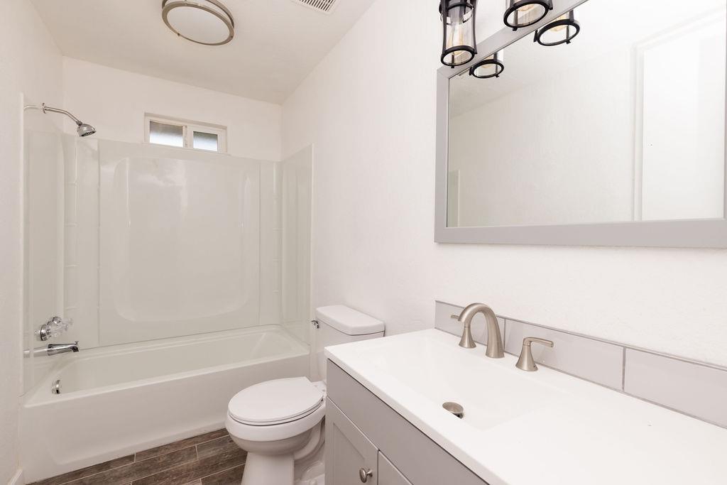 28369 Road 400 Madera, CA 93636 - Photo 15 of 33 a bathroom with a sink a toilet and shower