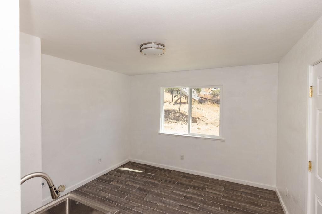 28369 Road 400 Madera, CA 93636 - Photo 18 of 33 a room with window and a wooden floor