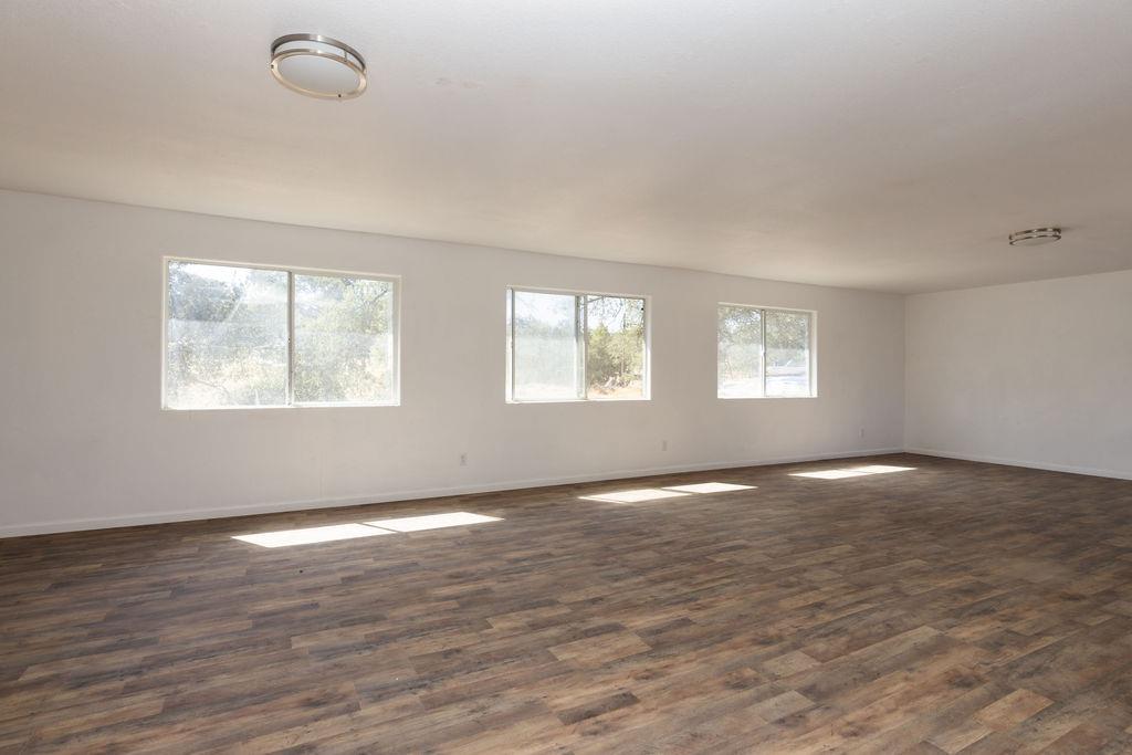 28369 Road 400 Madera, CA 93636 - Photo 20 of 33 a view of an empty room with wooden floor and a window