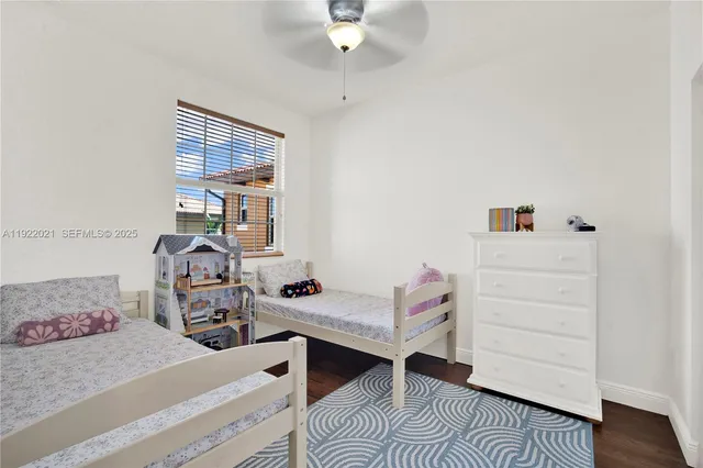 a bedroom with furniture and a window