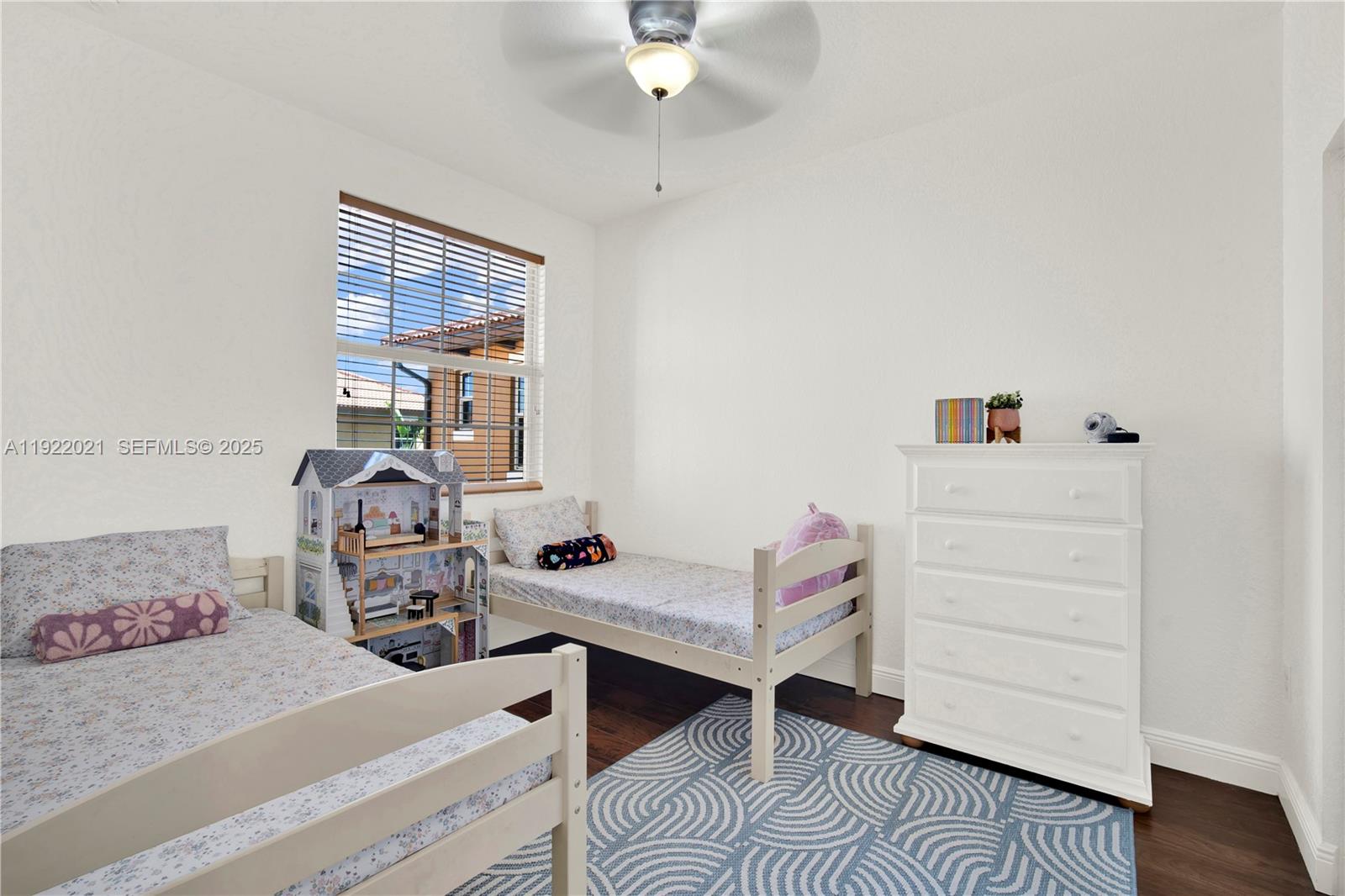 1121 Southwest 147th Terrace Pembroke Pines, FL 33027 - Photo 18 of 32 a bedroom with furniture and a window