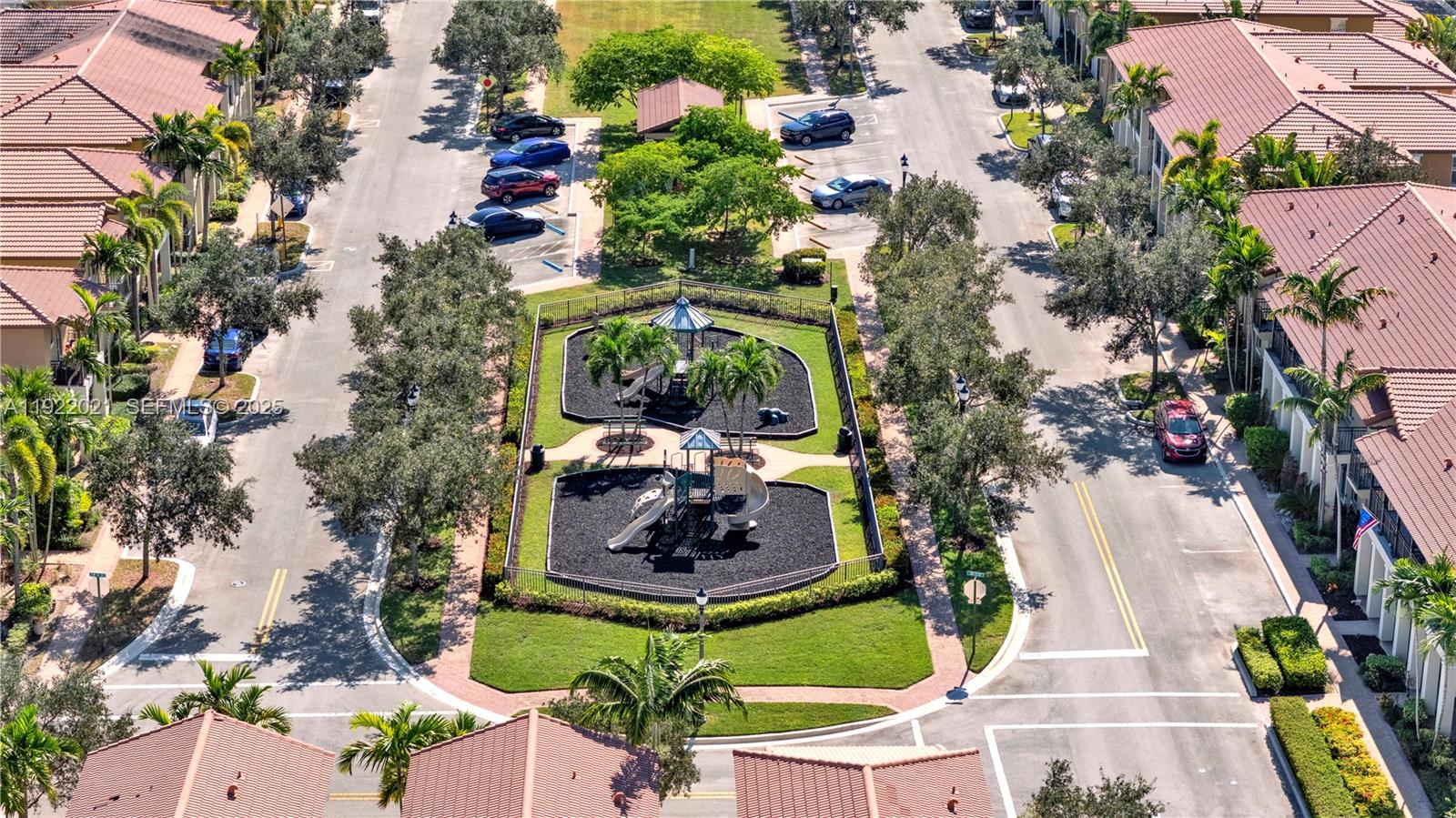 1121 Southwest 147th Terrace Pembroke Pines, FL 33027 - Photo 27 of 32 an aerial view of a house with a yard and large trees