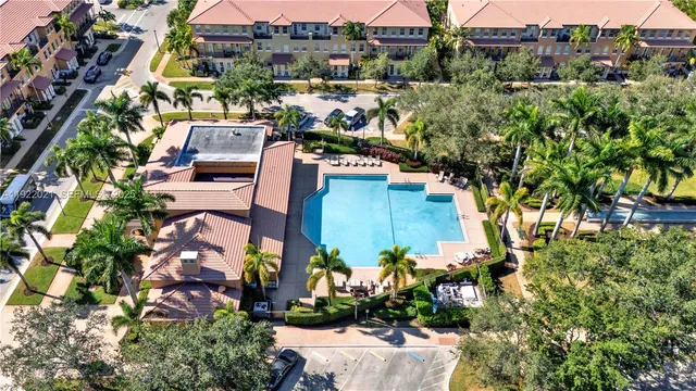 an aerial view of a houses with yard