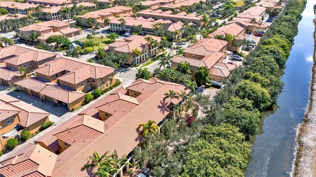 an aerial view of residential houses with outdoor space
