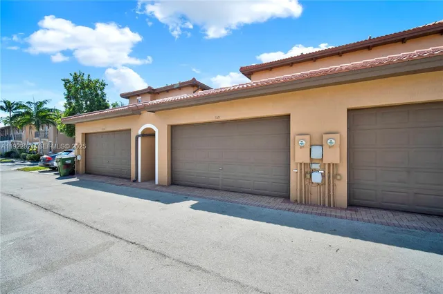 a front view of a house with a garage