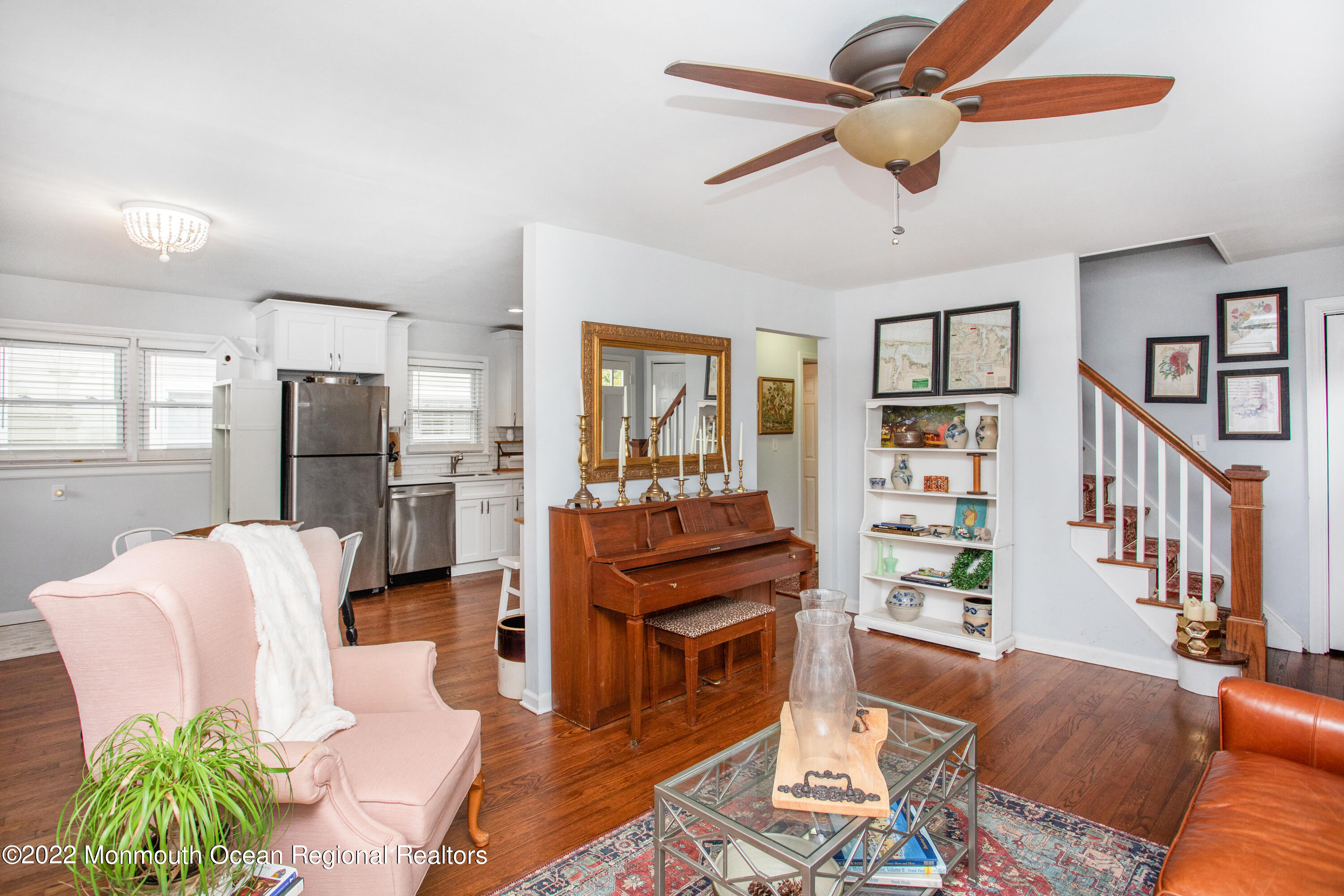111 Manito Road Manasquan, NJ 08736 - Photo 11 of 37 a living room with furniture and a chandelier