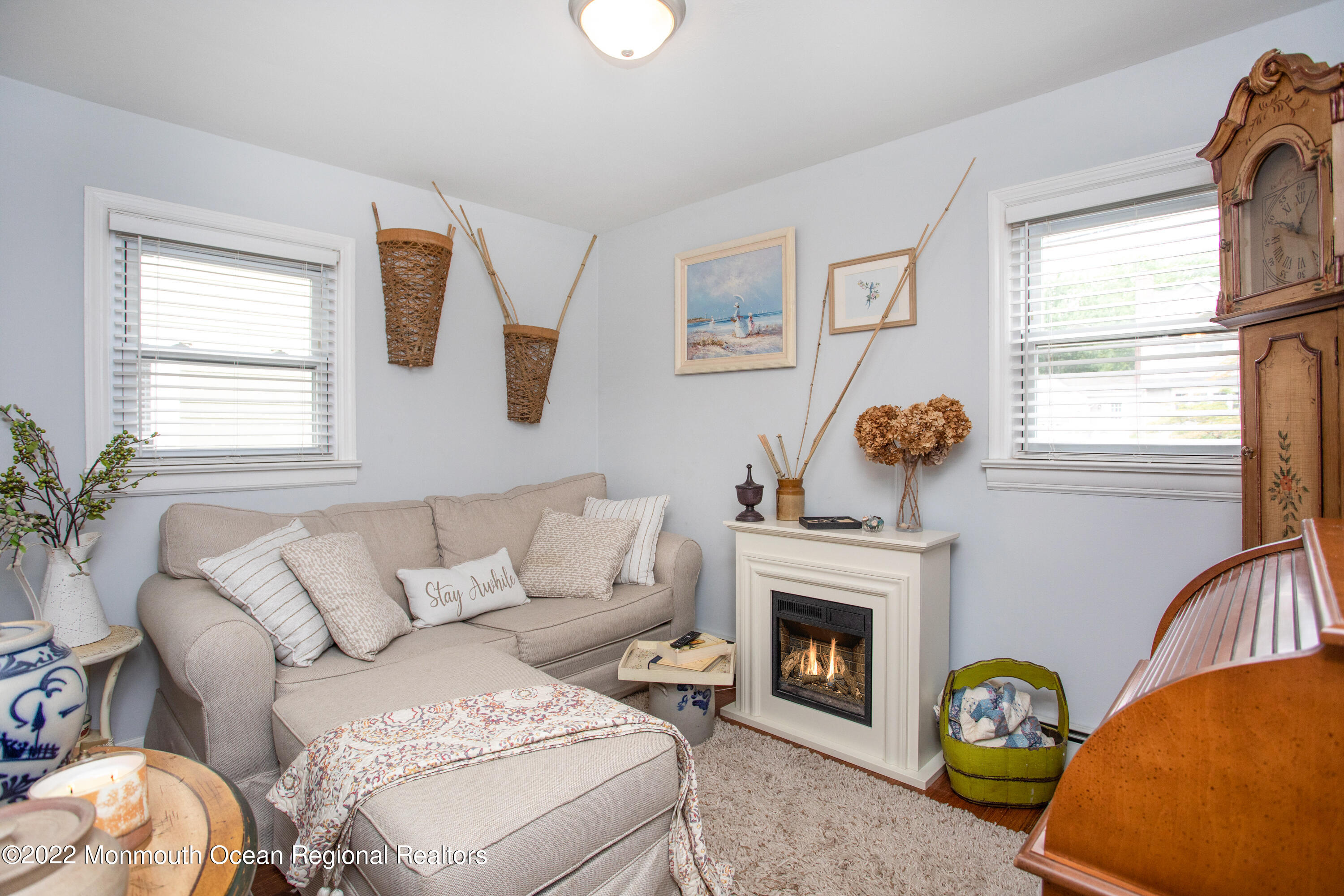 111 Manito Road Manasquan, NJ 08736 - Photo 19 of 37 a living room with furniture a window and a fireplace