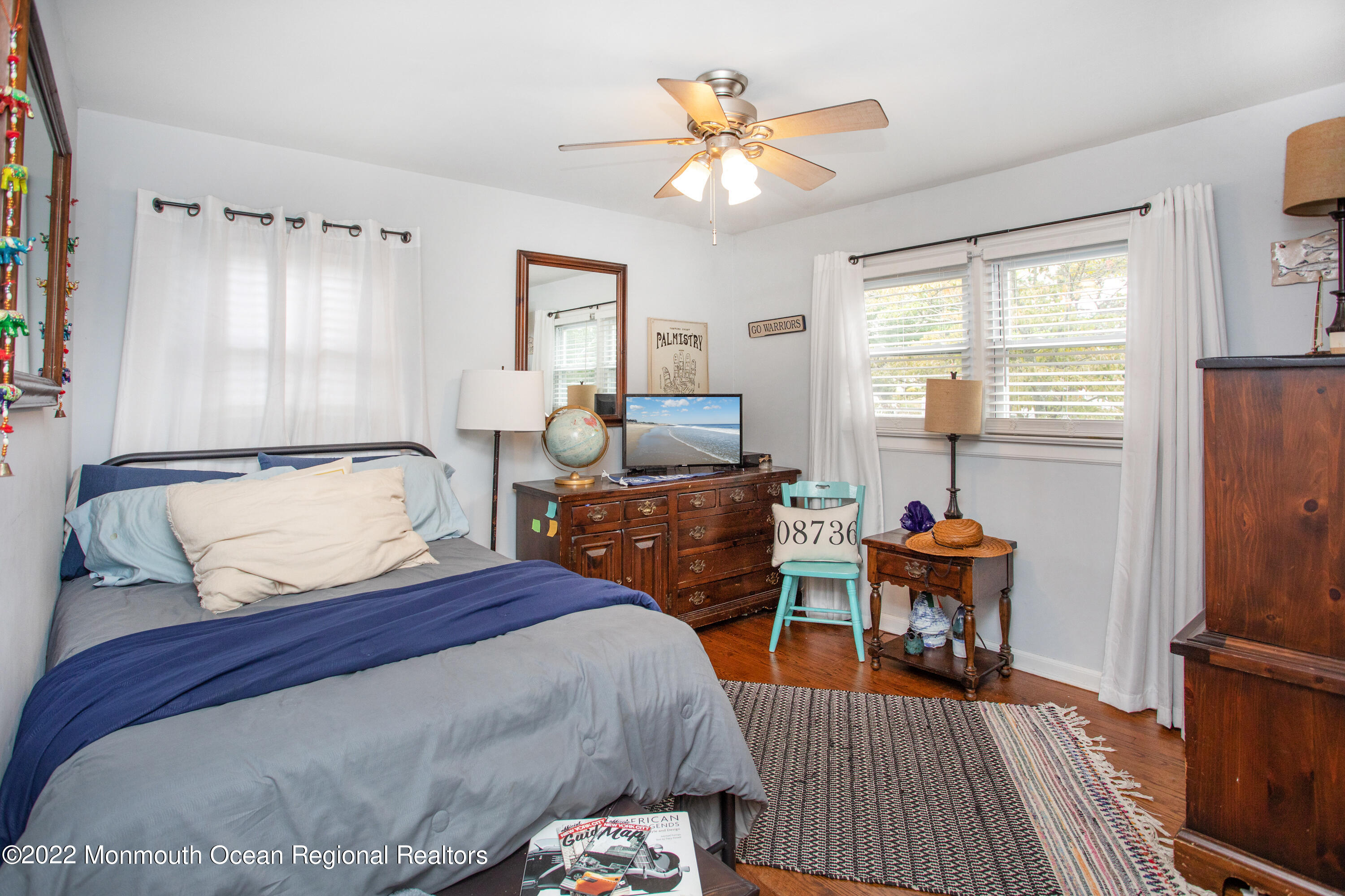 111 Manito Road Manasquan, NJ 08736 - Photo 20 of 37 a bedroom with a bed and wooden floor