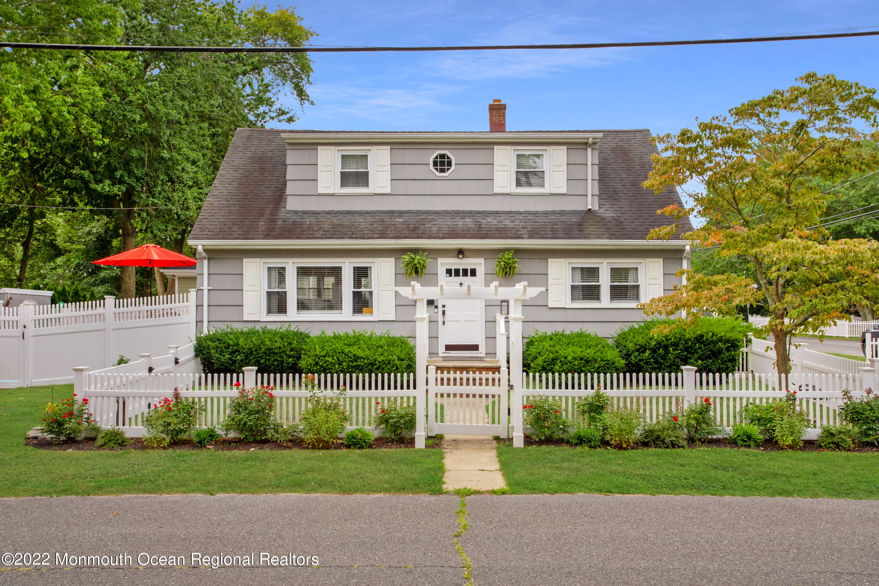 111 Manito Road Manasquan, NJ 08736 - Photo 2 of 37 a front view of a house with a yard