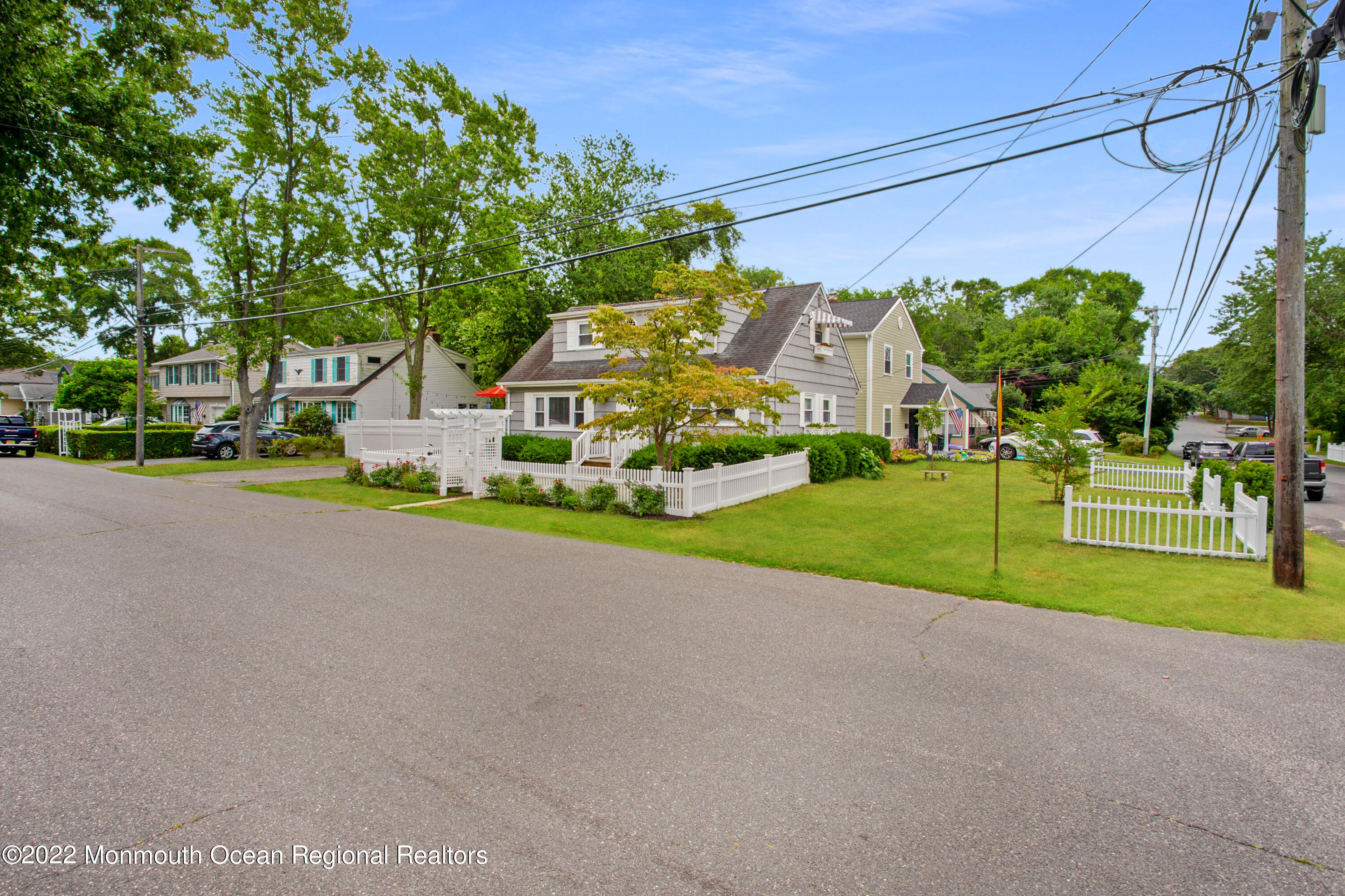 111 Manito Road Manasquan, NJ 08736 - Photo 32 of 37 a view of a house with a big yard and large trees