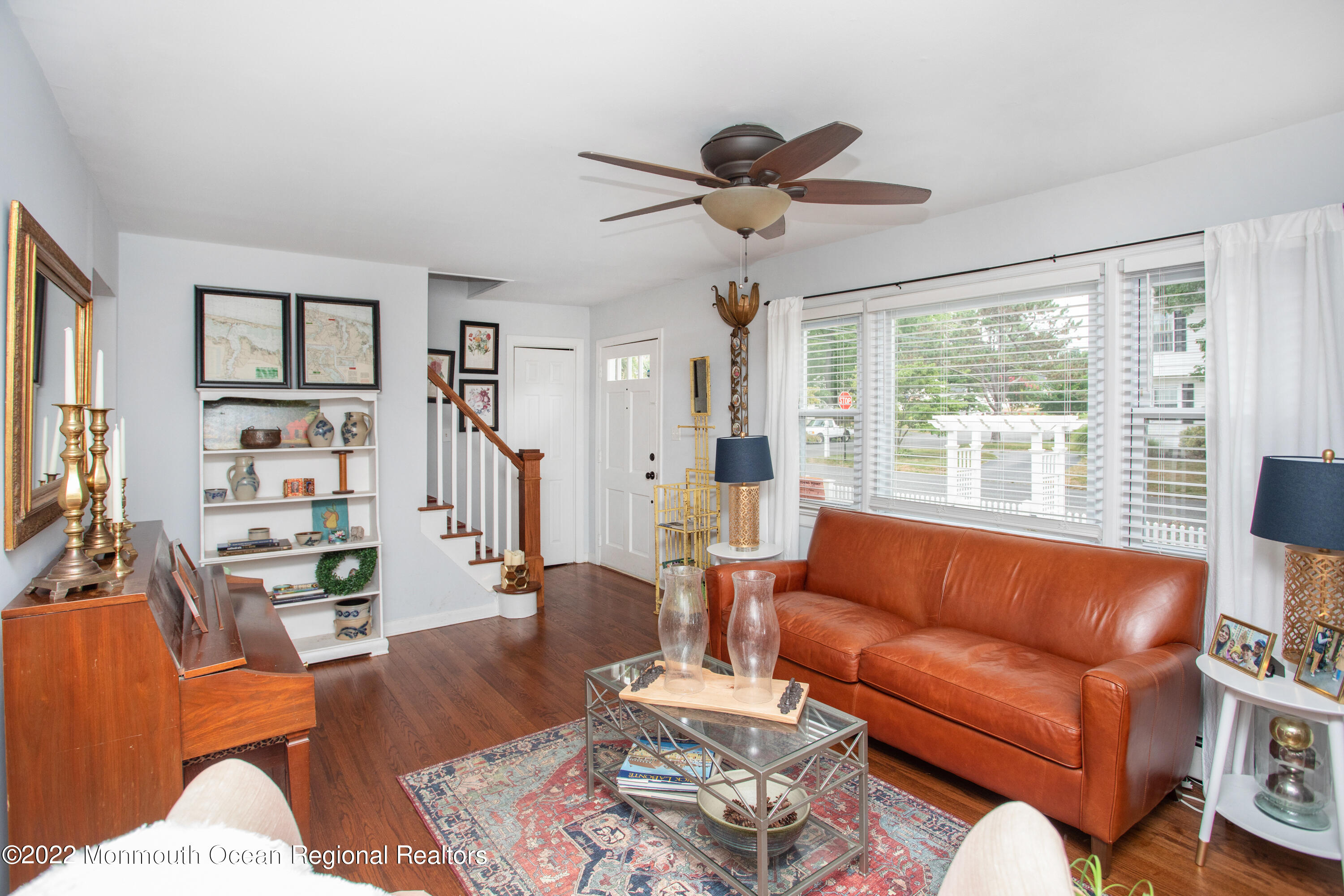 111 Manito Road Manasquan, NJ 08736 - Photo 7 of 37 a living room with furniture kitchen view and a large window