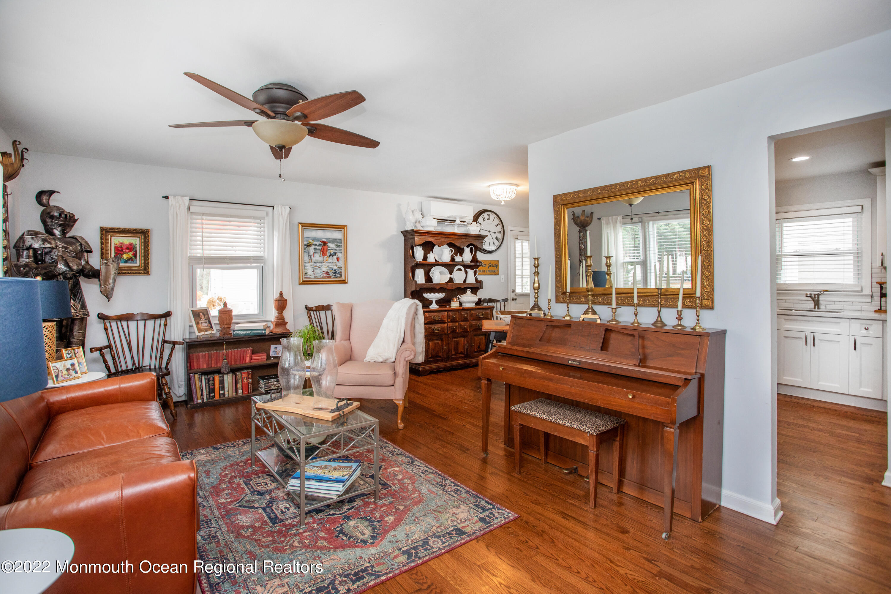 111 Manito Road Manasquan, NJ 08736 - Photo 8 of 37 a living room with furniture a rug and a dining table