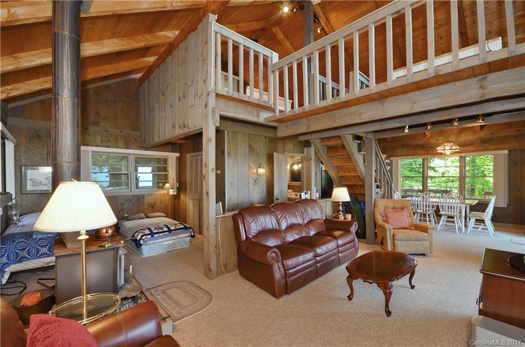 381 Norman Road Clyde, NC 28721 - Photo 2 of 21 a outdoor living space with furniture and a table