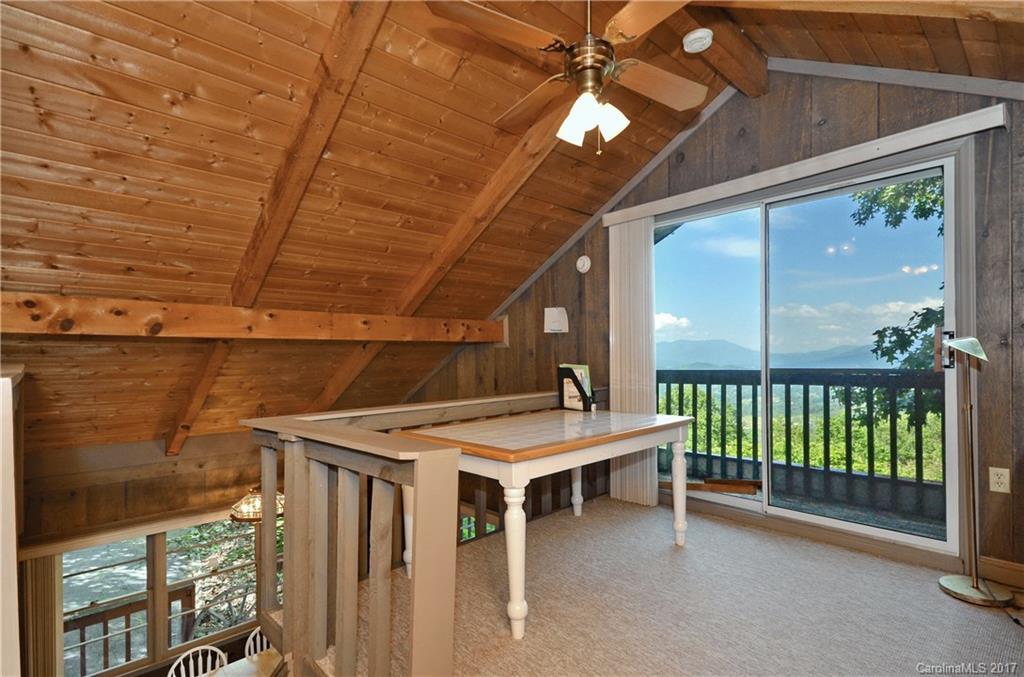 381 Norman Road Clyde, NC 28721 - Photo 11 of 21 a view of a patio with a table and chairs