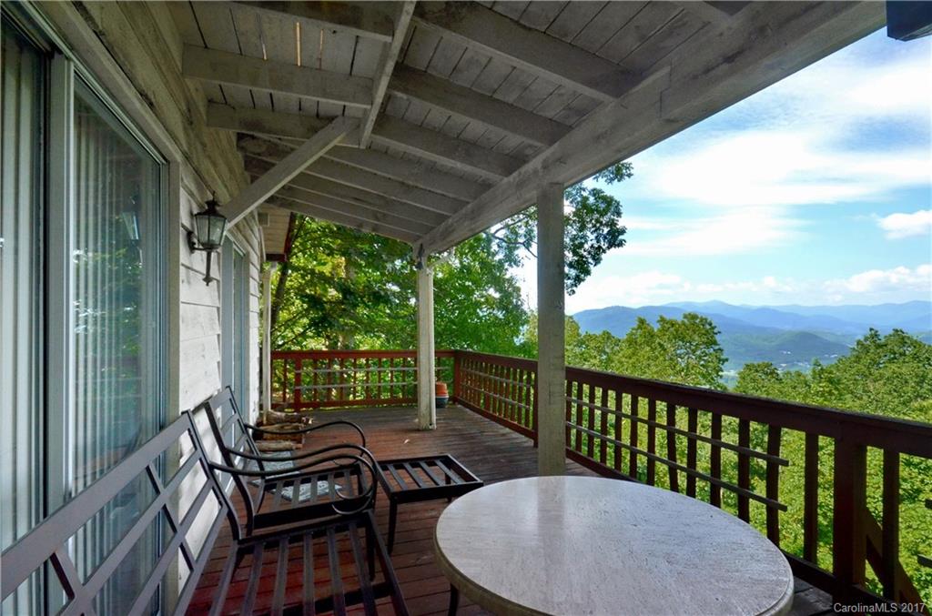 381 Norman Road Clyde, NC 28721 - Photo 13 of 21 a view of a balcony with chairs