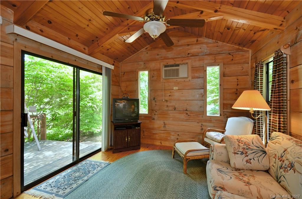 381 Norman Road Clyde, NC 28721 - Photo 17 of 21 a balcony with furniture and a ceiling fan