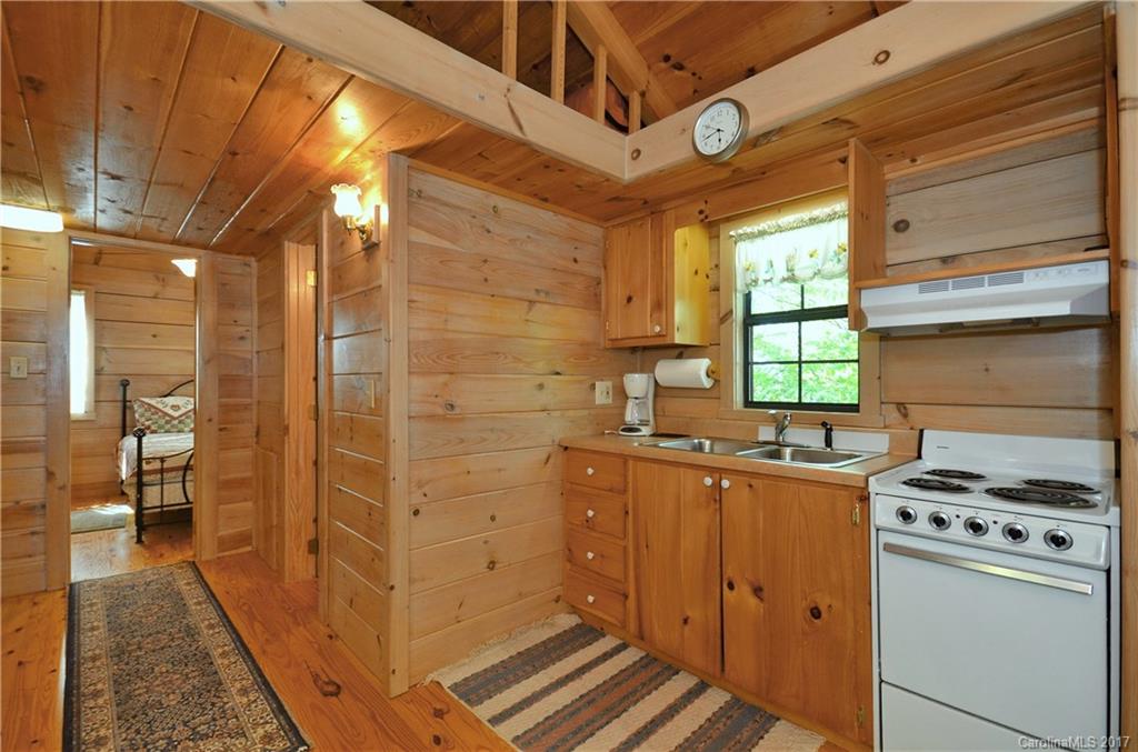 381 Norman Road Clyde, NC 28721 - Photo 19 of 21 a room with storage and utility