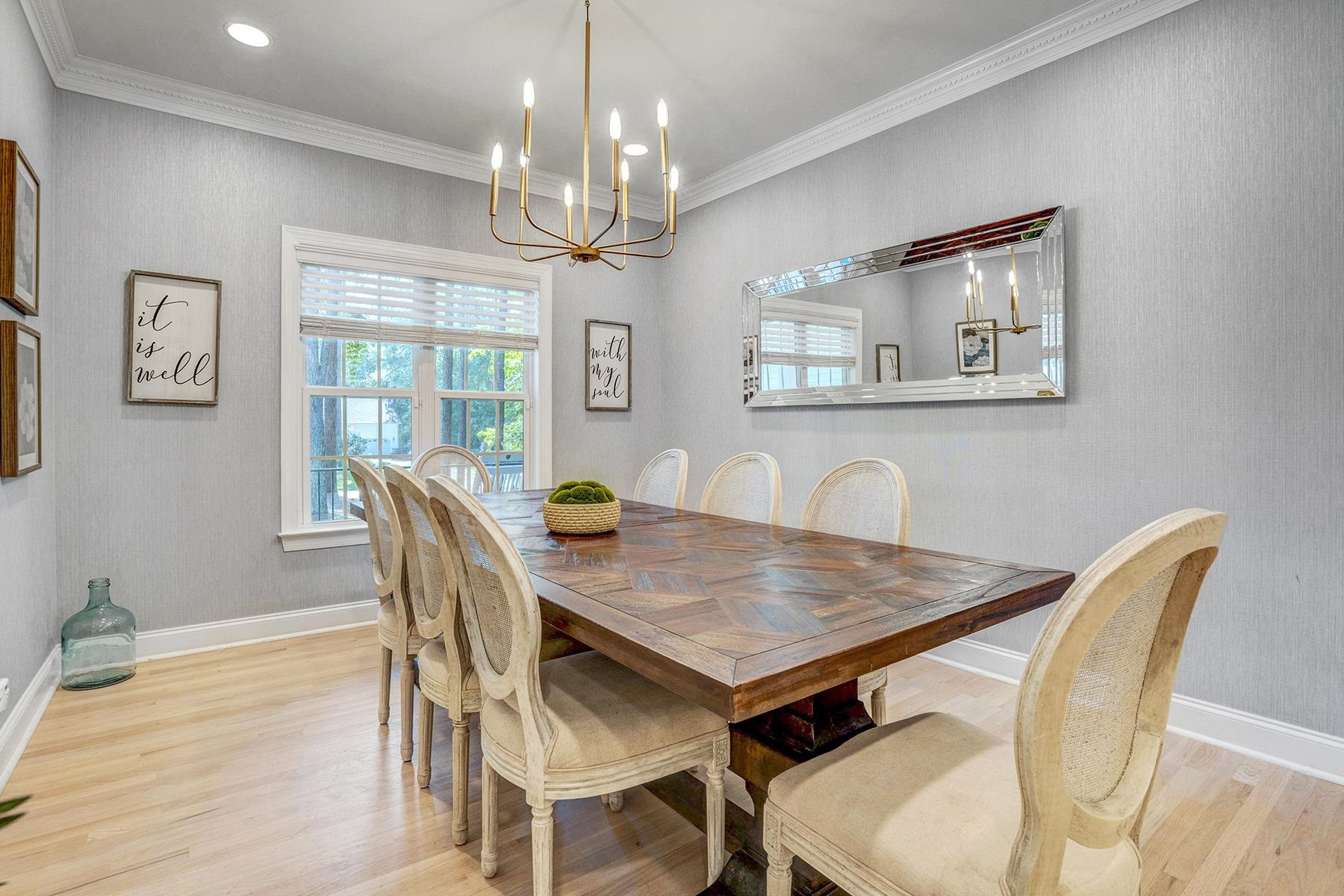 163 Winfred Drive Raleigh, NC 27603 - Photo 12 of 39 a view of a dining room with furniture wooden floor and chandelier