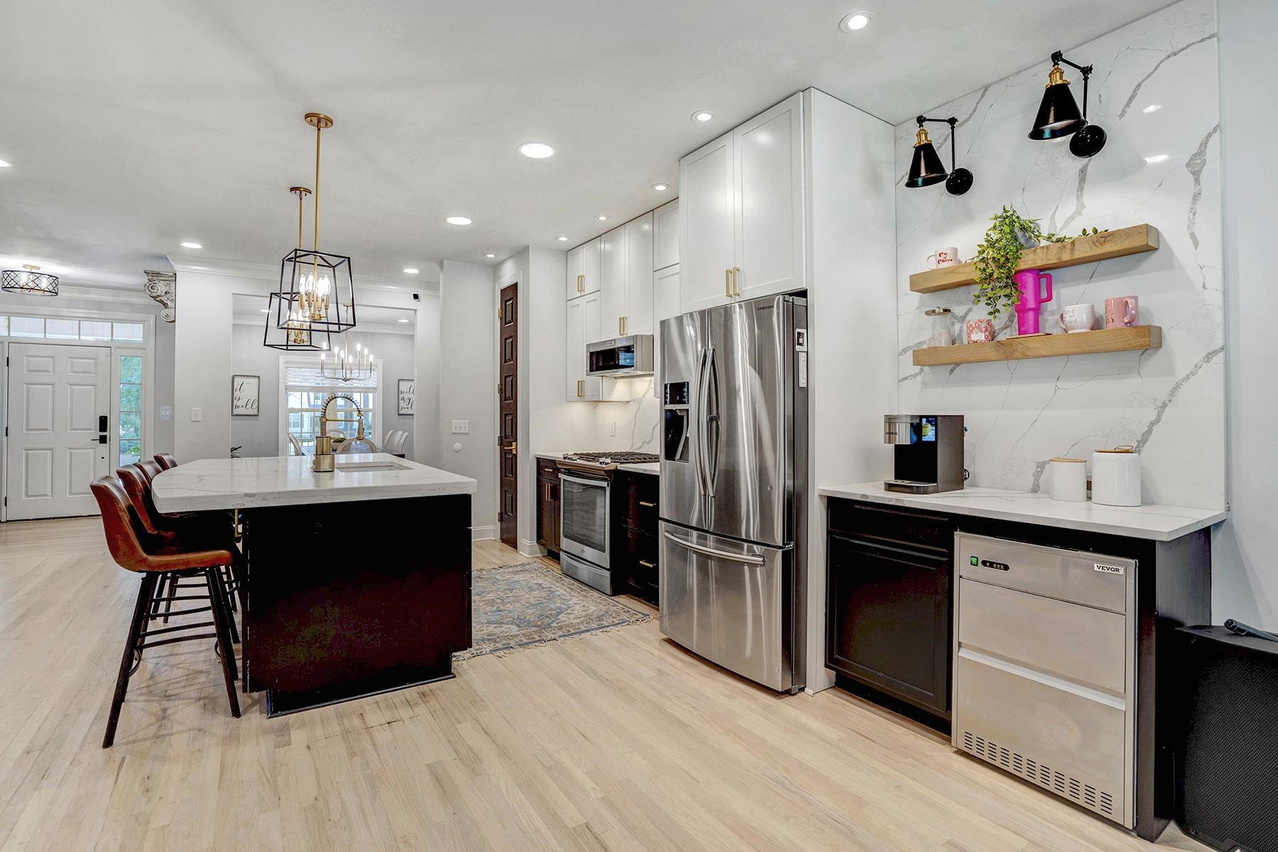 163 Winfred Drive Raleigh, NC 27603 - Photo 17 of 39 a kitchen with granite countertop a refrigerator and a stove top oven