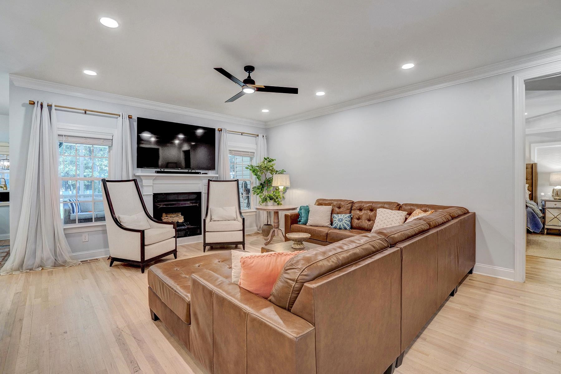 163 Winfred Drive Raleigh, NC 27603 - Photo 19 of 39 a living room with furniture and a flat screen tv