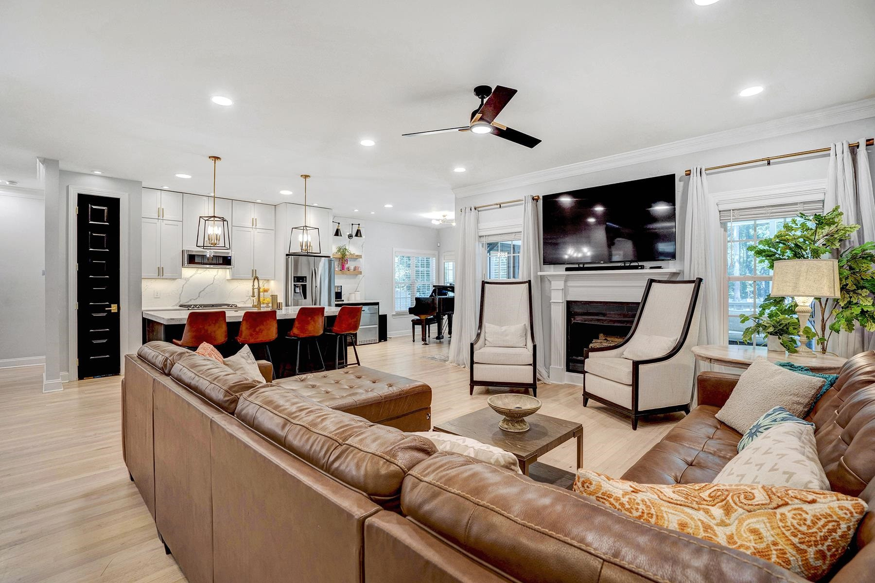 163 Winfred Drive Raleigh, NC 27603 - Photo 20 of 39 a living room with furniture and a flat screen tv