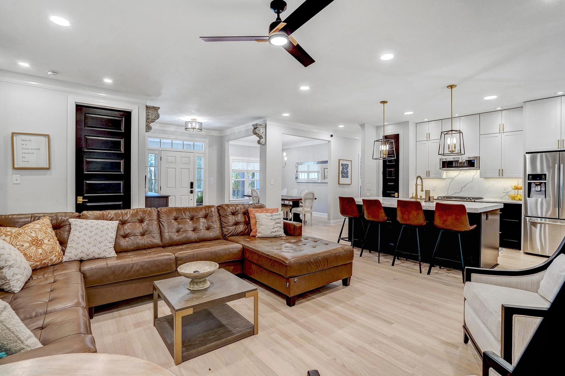 163 Winfred Drive Raleigh, NC 27603 - Photo 21 of 39 a living room with furniture kitchen view and a chandelier