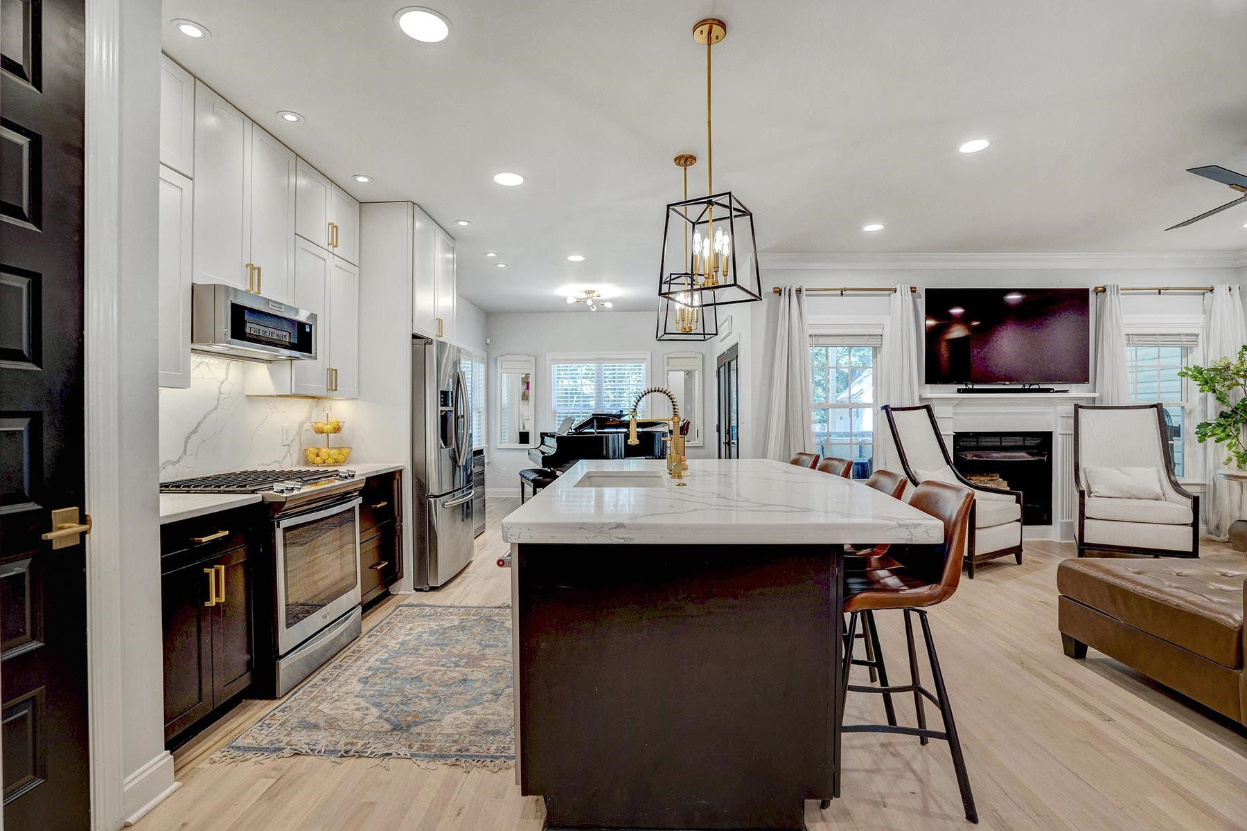 163 Winfred Drive Raleigh, NC 27603 - Photo 22 of 39 a kitchen with kitchen island a sink appliances and a counter top space
