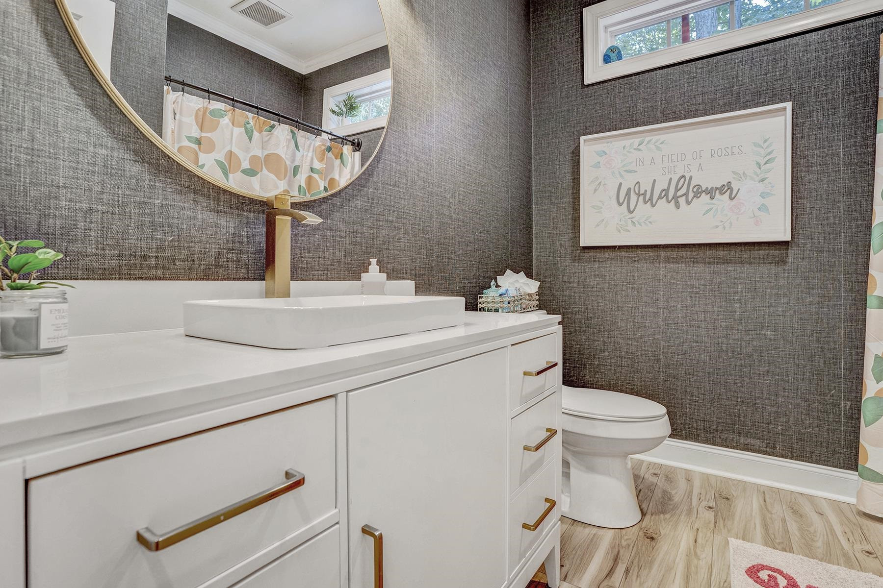 163 Winfred Drive Raleigh, NC 27603 - Photo 25 of 39 a bathroom with a toilet sink and mirror