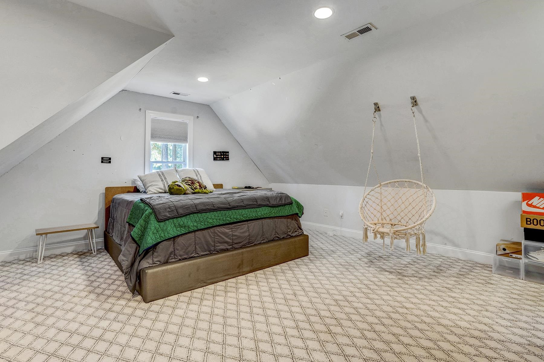 163 Winfred Drive Raleigh, NC 27603 - Photo 33 of 39 a bedroom with a bed and chair