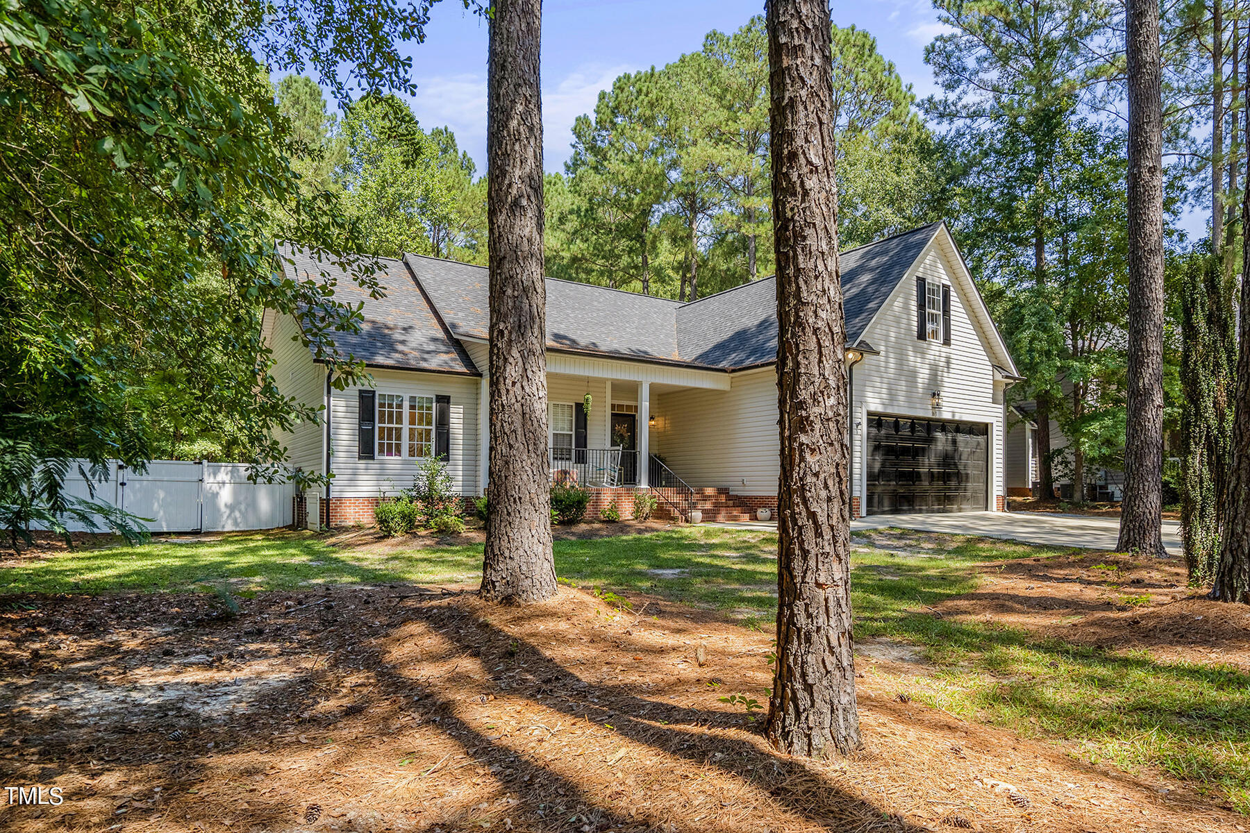 163 Winfred Drive Raleigh, NC 27603 - Photo 5 of 39 a front view of a house with garden