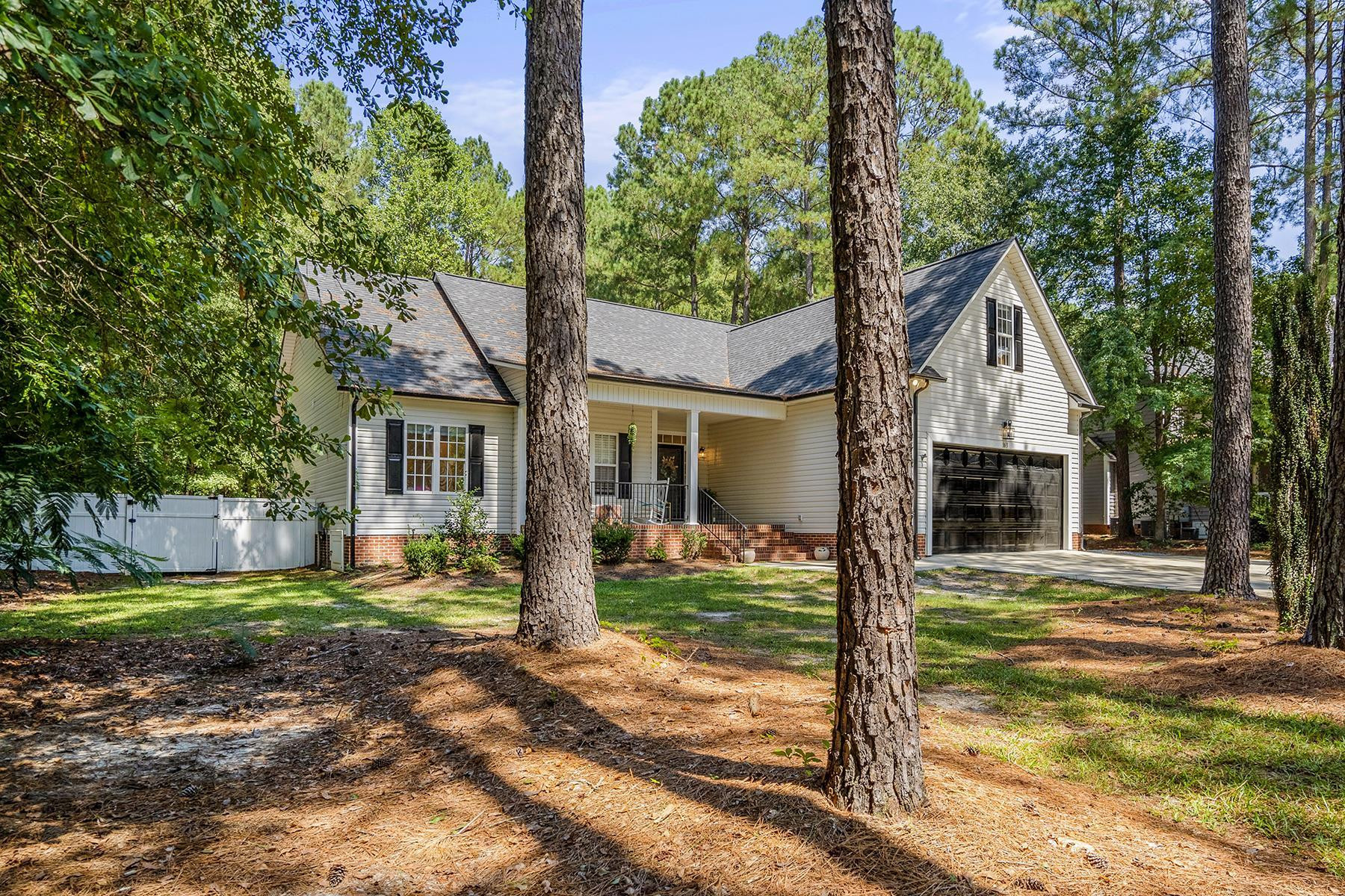 163 Winfred Drive Raleigh, NC 27603 - Photo 9 of 39 a front view of a house with garden