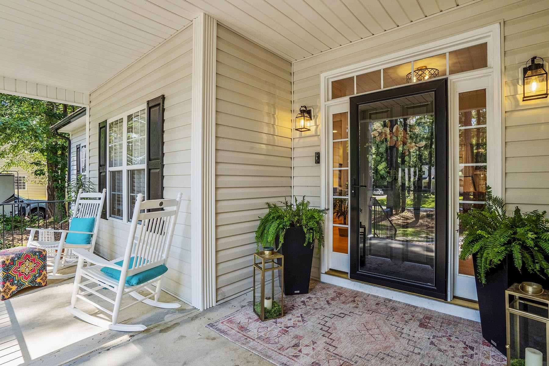163 Winfred Drive Raleigh, NC 27603 - Photo 10 of 39 a view of an outdoor space with porch and wooden floor