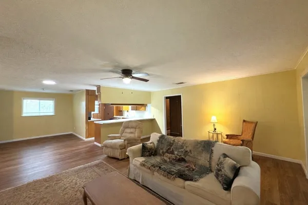 a spacious bedroom with a bed and window