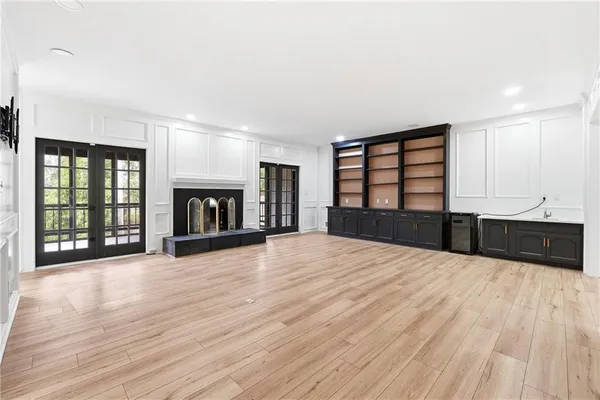 a large room with kitchen view