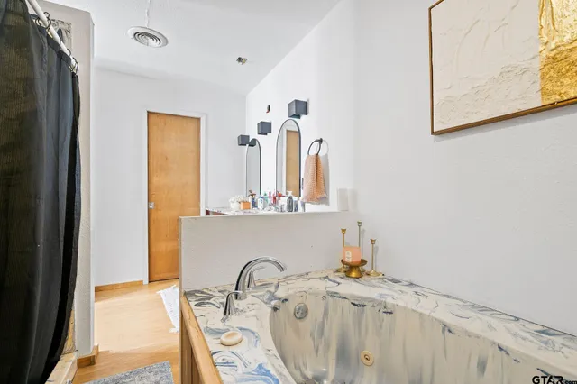 a bathroom with a sink and a mirror