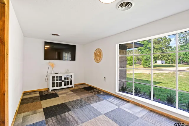 a view of a livingroom with furniture and windows