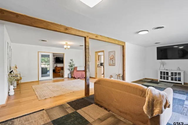 a bed room with a bed and a television