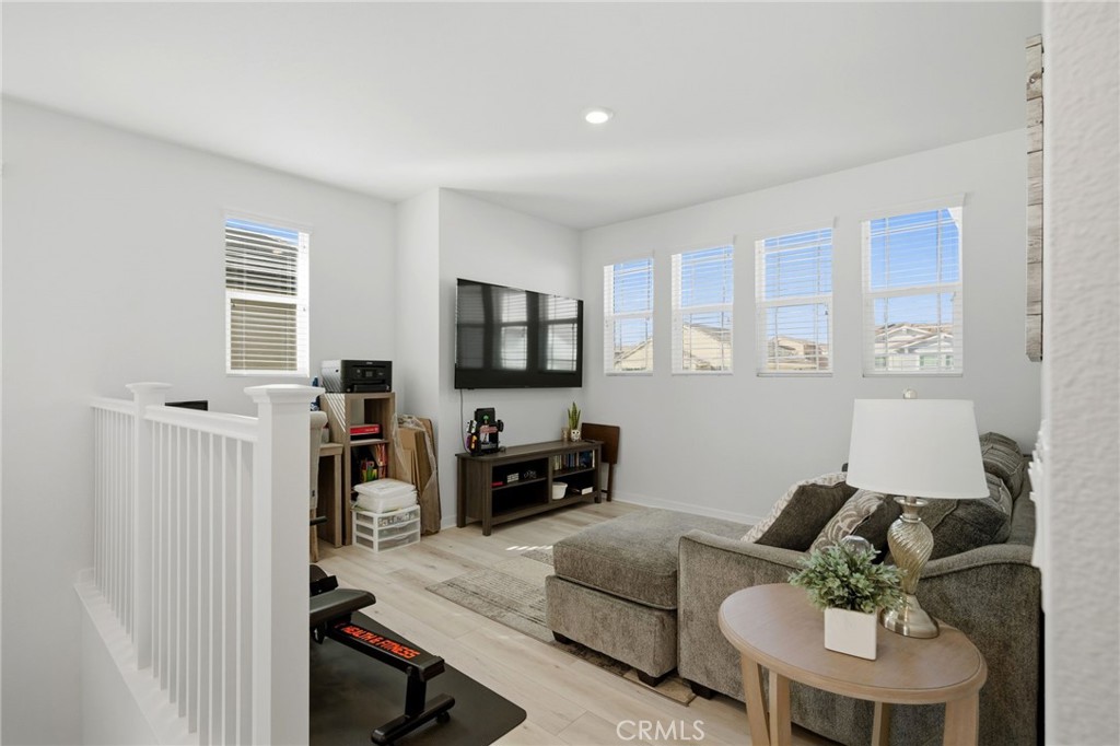 32243 Penstemon Way Temecula, CA 92591 - Photo 18 of 26 a living room with furniture and a flat screen tv