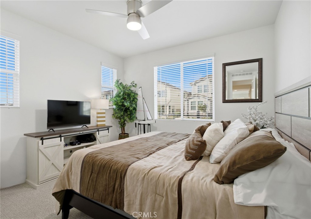 32243 Penstemon Way Temecula, CA 92591 - Photo 20 of 26 a bedroom with a bed and a flat screen tv