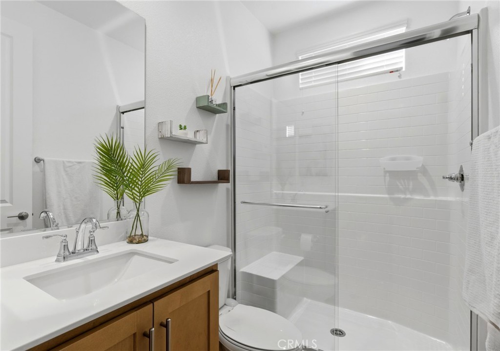 32243 Penstemon Way Temecula, CA 92591 - Photo 21 of 26 a bathroom with a sink toilet and shower