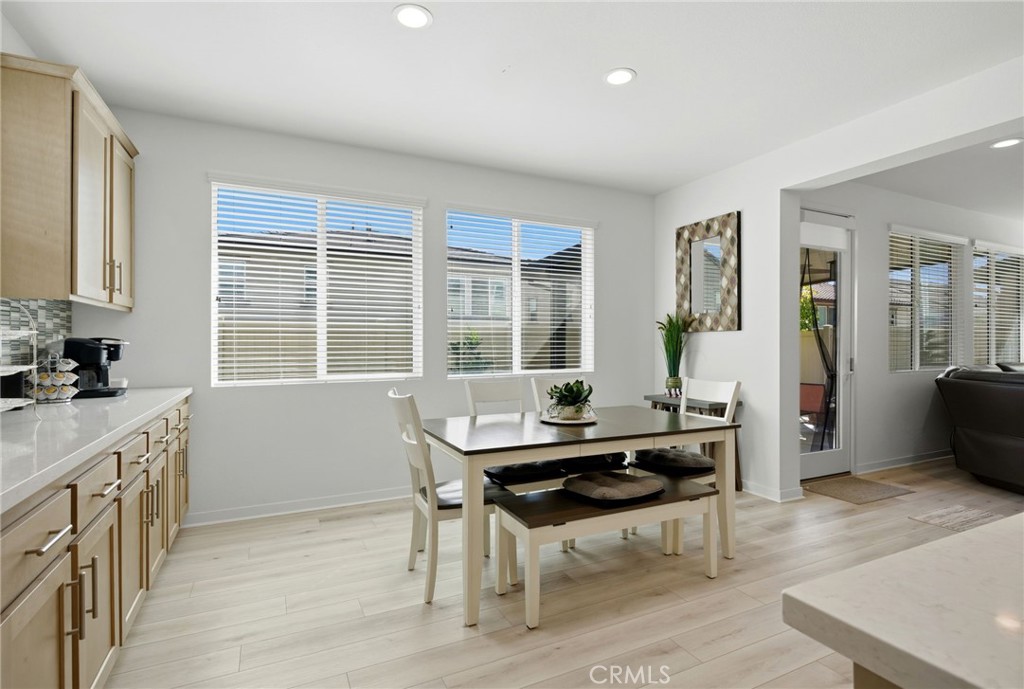32243 Penstemon Way Temecula, CA 92591 - Photo 7 of 26 a view of a kitchen with a table and chairs
